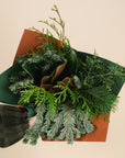 bouquet of mixed winter greenery