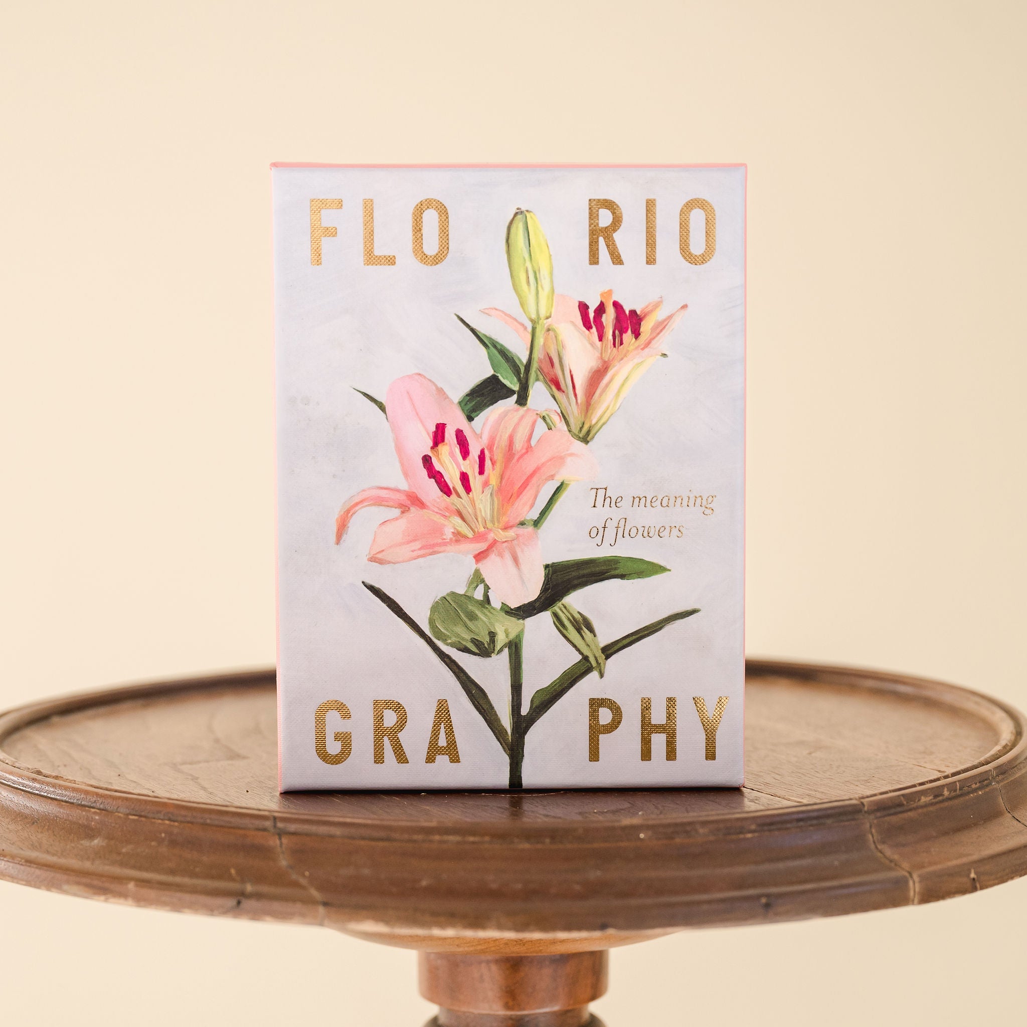 photo of the floriography box on a round wooden stool