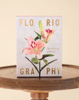 photo of the floriography box on a round wooden stool