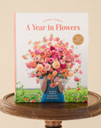 front cover of A Year in Flowers sitting on a wooden stool